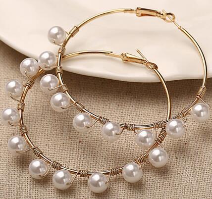 Pearls wrapped around ear rings